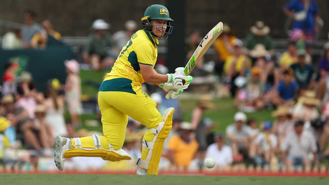 Australian cricketer running between wickets in action