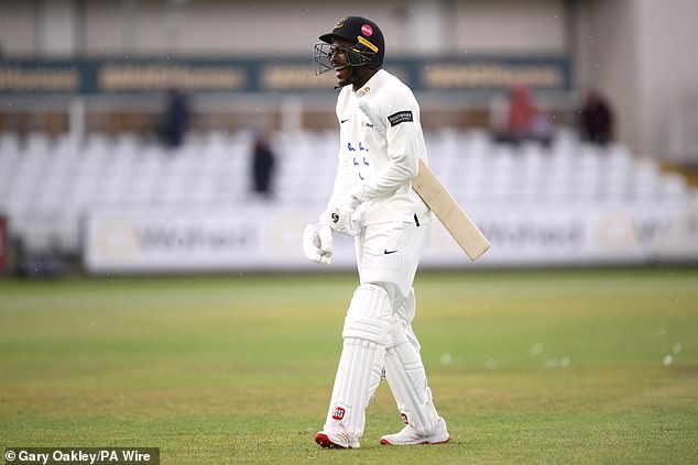 Jofra Archer walking on cricket field in whites